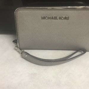 Gently used Michael Kors wristlet/ walle